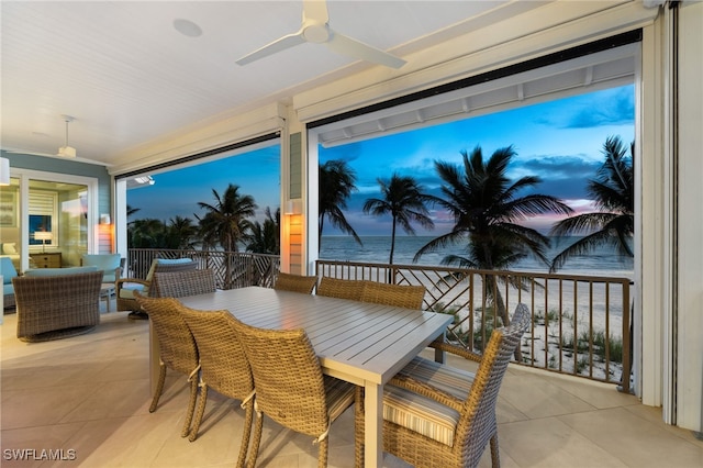 view of patio featuring outdoor dining area, a balcony, and ceiling fan