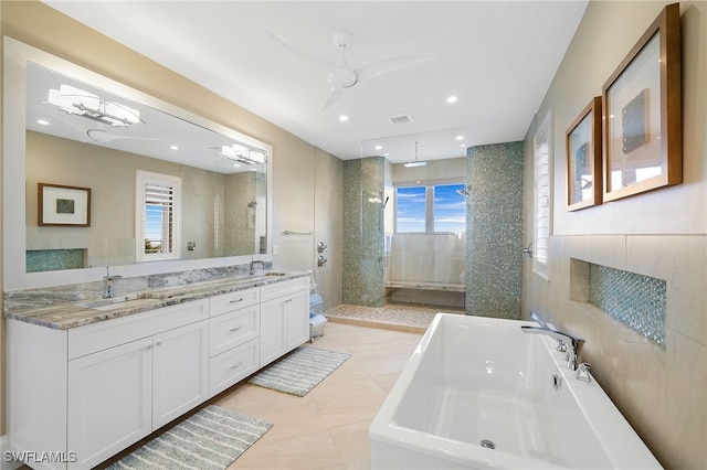 bathroom featuring a sink, visible vents, a soaking tub, and a walk in shower