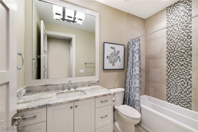 full bath featuring shower / tub combo with curtain, toilet, and vanity