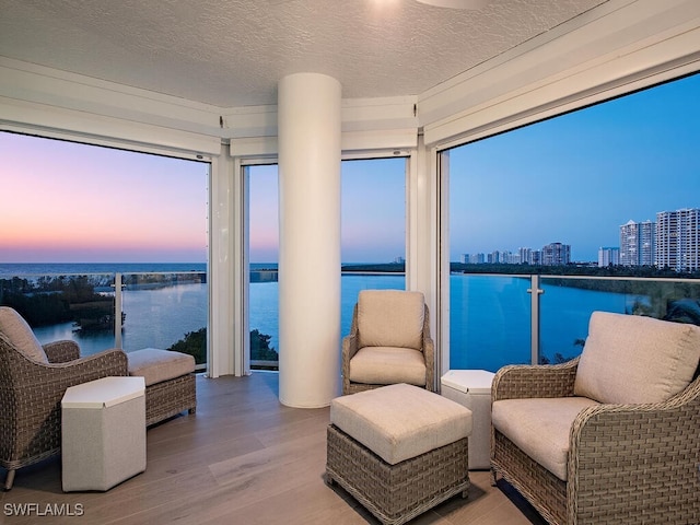 interior space featuring a water view and a city view