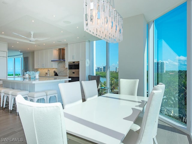 dining area with plenty of natural light, recessed lighting, a ceiling fan, and light wood-style floors