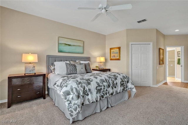 bedroom with carpet, a closet, visible vents, and baseboards