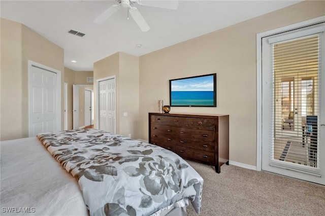 carpeted bedroom featuring access to exterior, ceiling fan, visible vents, and baseboards