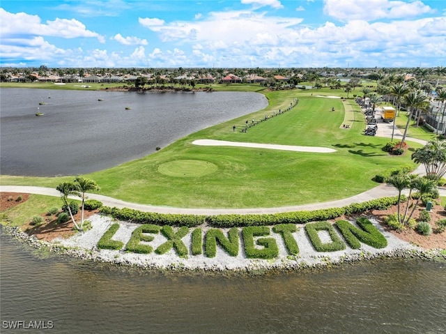 aerial view featuring a water view and golf course view