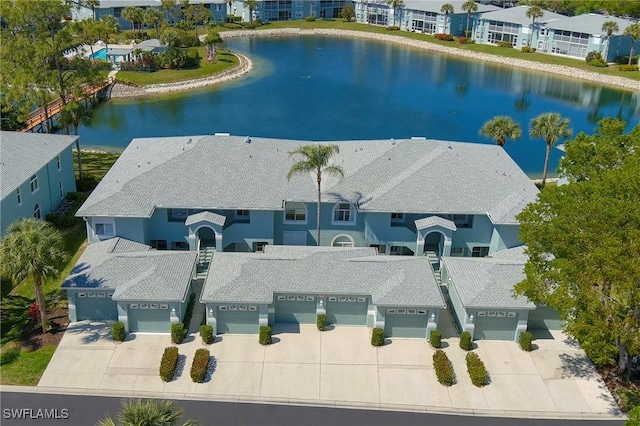 aerial view featuring a water view and a residential view