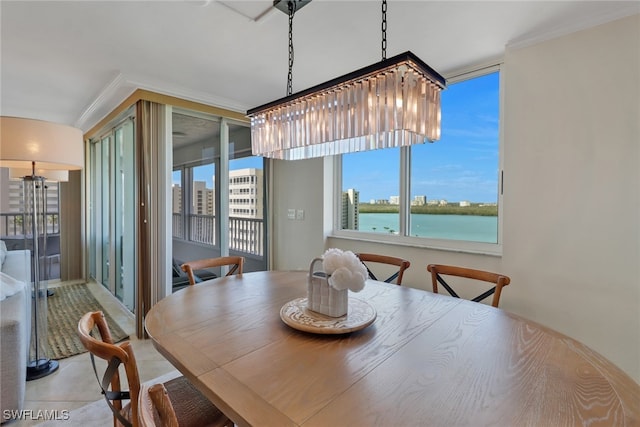 dining area featuring crown molding