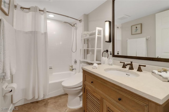 bathroom featuring shower / tub combo, vanity, toilet, and tile patterned floors