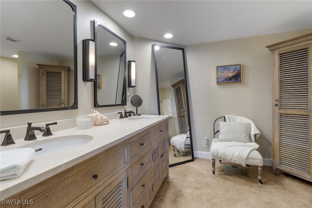 full bathroom with baseboards, a closet, a sink, and recessed lighting