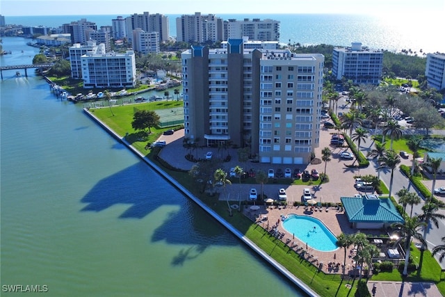 drone / aerial view with a view of city and a water view