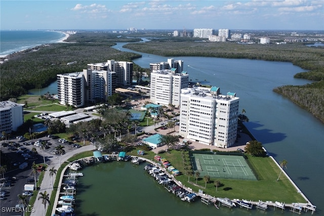 birds eye view of property featuring a water view and a view of city