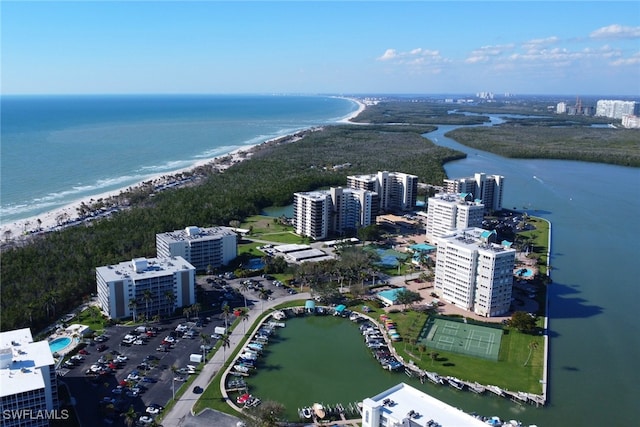 birds eye view of property with a water view and a view of city