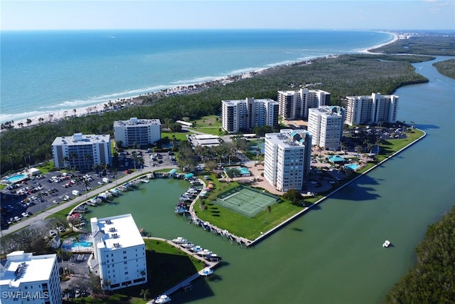 birds eye view of property featuring a water view and a view of city