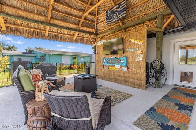 view of patio / terrace featuring an outdoor living space and fence