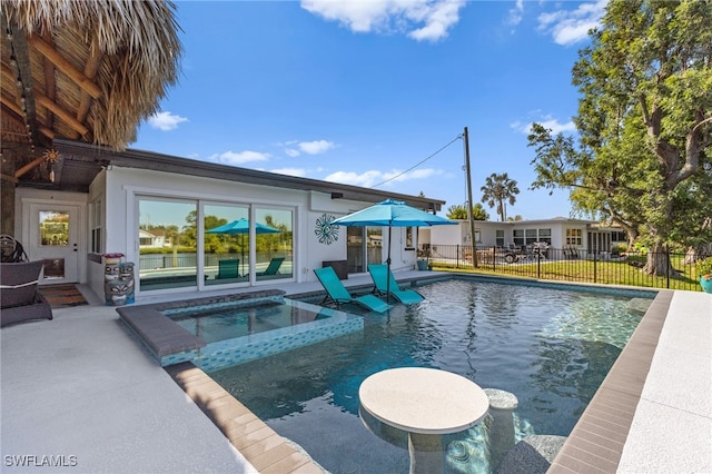 view of swimming pool with a fenced in pool, a patio, an in ground hot tub, and fence