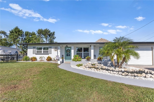 ranch-style house with fence, stucco siding, a front lawn, concrete driveway, and a garage