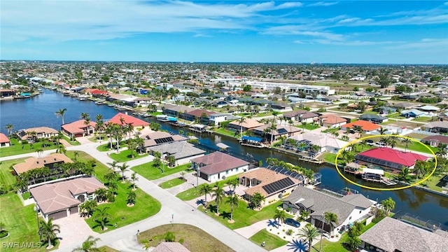 aerial view with a residential view and a water view