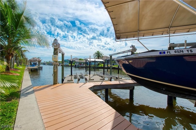 dock area featuring a water view and boat lift