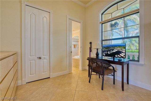 office area featuring crown molding, baseboards, and light tile patterned floors