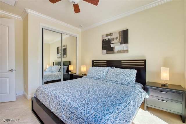 bedroom with baseboards, a ceiling fan, ornamental molding, a closet, and light tile patterned flooring