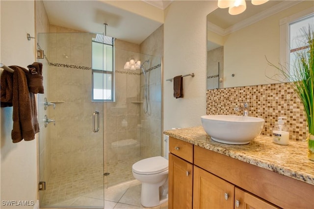 bathroom featuring ornamental molding, a stall shower, vanity, and tasteful backsplash