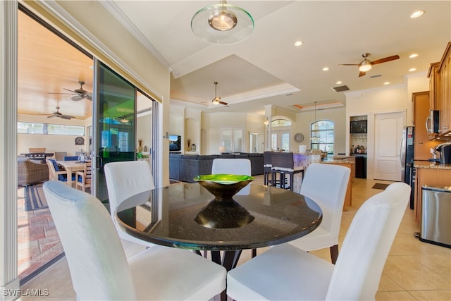 dining area featuring ceiling fan, a raised ceiling, crown molding, and recessed lighting