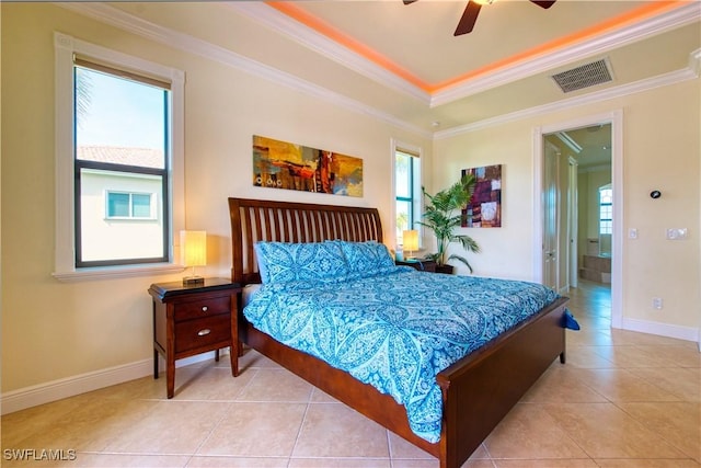 tiled bedroom featuring crown molding, a raised ceiling, visible vents, ceiling fan, and baseboards