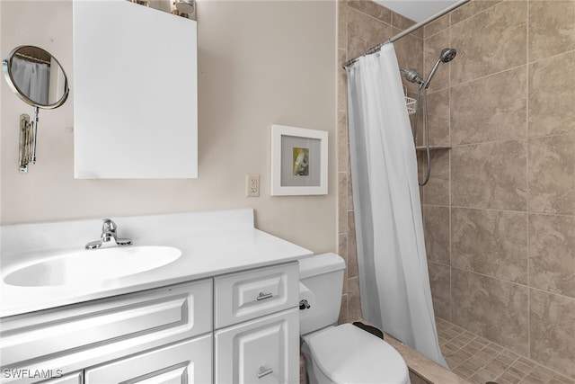 full bathroom with a shower stall, toilet, and vanity