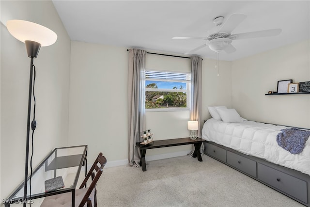 carpeted bedroom with baseboards and a ceiling fan