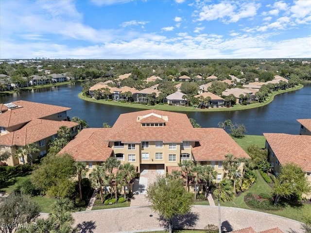 birds eye view of property featuring a water view and a residential view