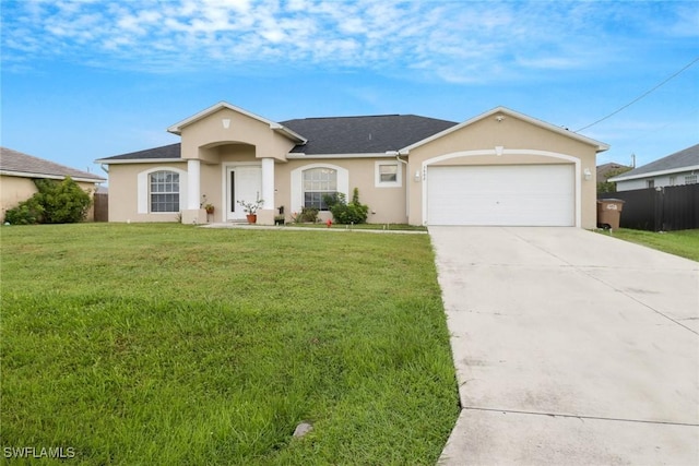 view of front facade featuring a garage, fence, concrete driveway, stucco siding, and a front lawn