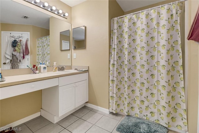 bathroom with curtained shower, visible vents, baseboards, vanity, and tile patterned floors