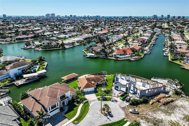 bird's eye view featuring a water view and a residential view