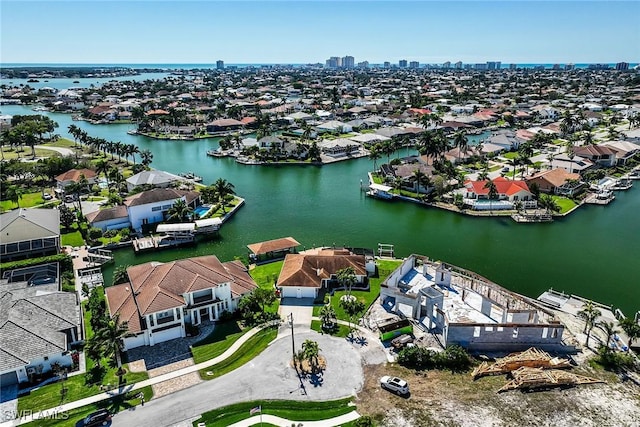 bird's eye view with a residential view and a water view