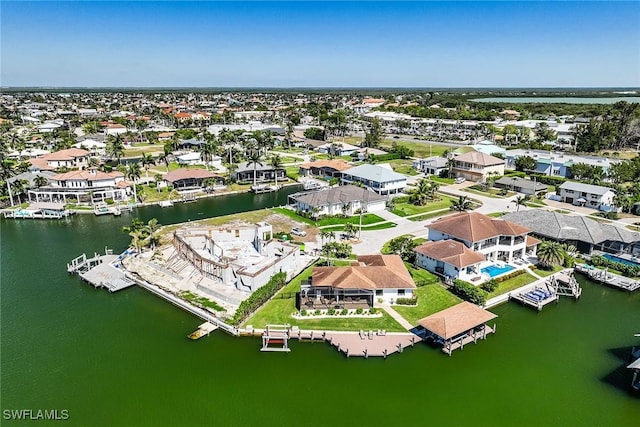 aerial view featuring a water view and a residential view