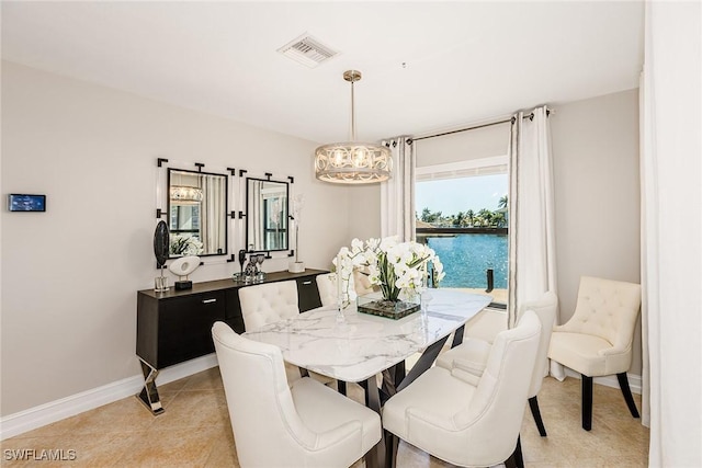 dining space with visible vents, baseboards, and light tile patterned floors