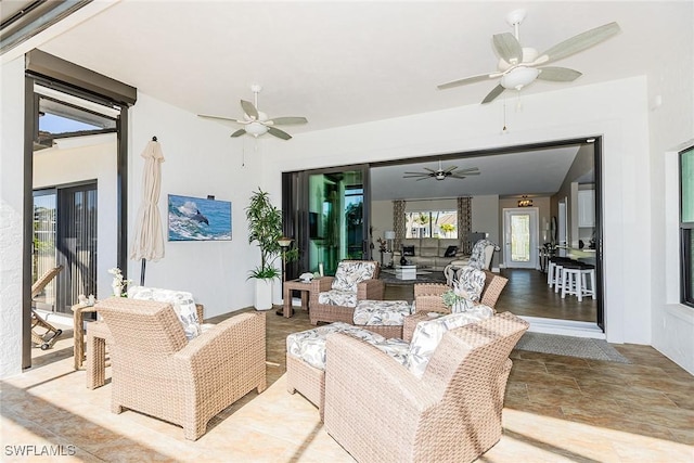 view of patio featuring outdoor lounge area and a ceiling fan