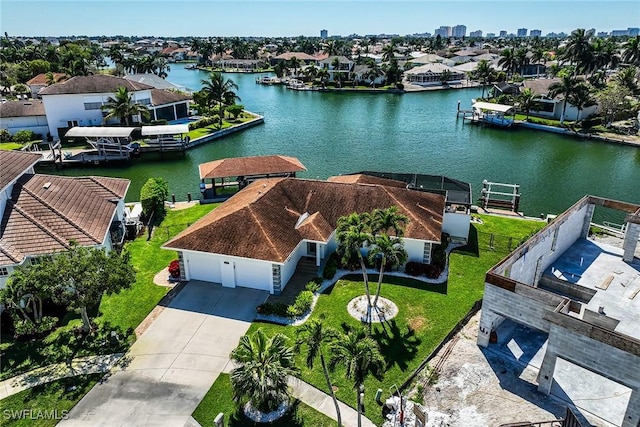 aerial view with a water view and a residential view