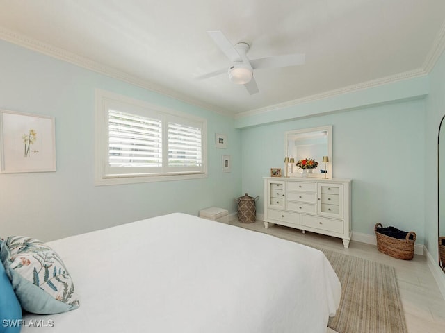 bedroom with baseboards, a ceiling fan, and crown molding