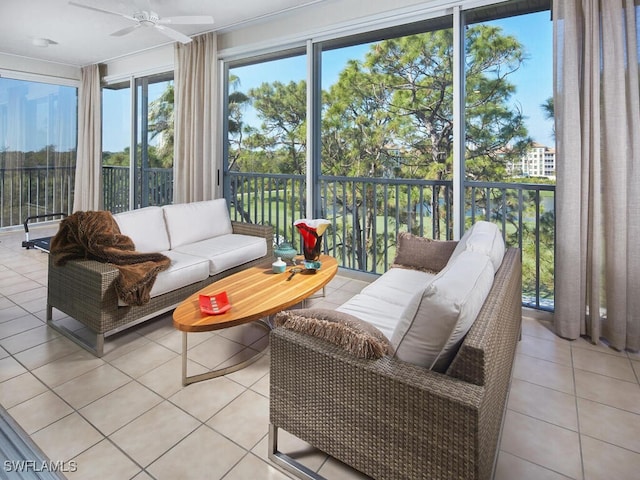 sunroom featuring ceiling fan