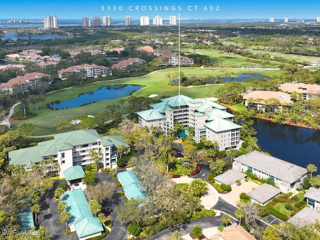 aerial view featuring view of golf course and a water view