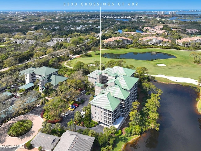 aerial view featuring a water view and golf course view