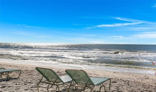 view of home's community featuring a view of the beach and a water view