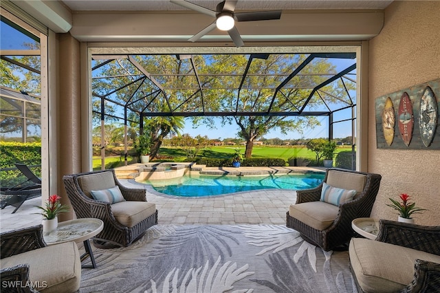 view of patio featuring glass enclosure, a ceiling fan, and a pool with connected hot tub