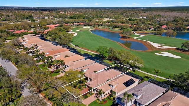 aerial view with a residential view, a water view, and view of golf course