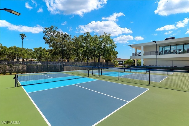 view of sport court with fence