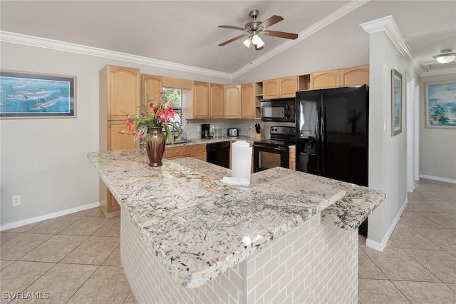 kitchen featuring lofted ceiling, light brown cabinets, a sink, black appliances, and crown molding