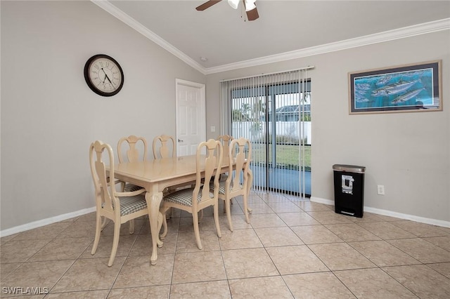 dining room with lofted ceiling, ceiling fan, light tile patterned floors, baseboards, and crown molding