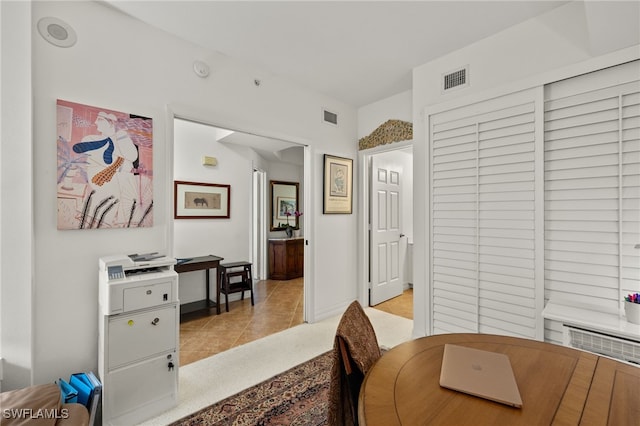 dining area with light tile patterned flooring, visible vents, and baseboards