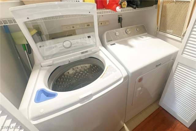 laundry room featuring laundry area and separate washer and dryer