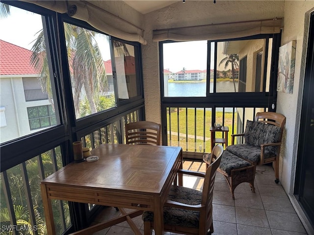 11570 Caravel Cir Unit 2022, Fort Myers, FL 33908 - sunroom / solarium with a water view and outdoor dining space